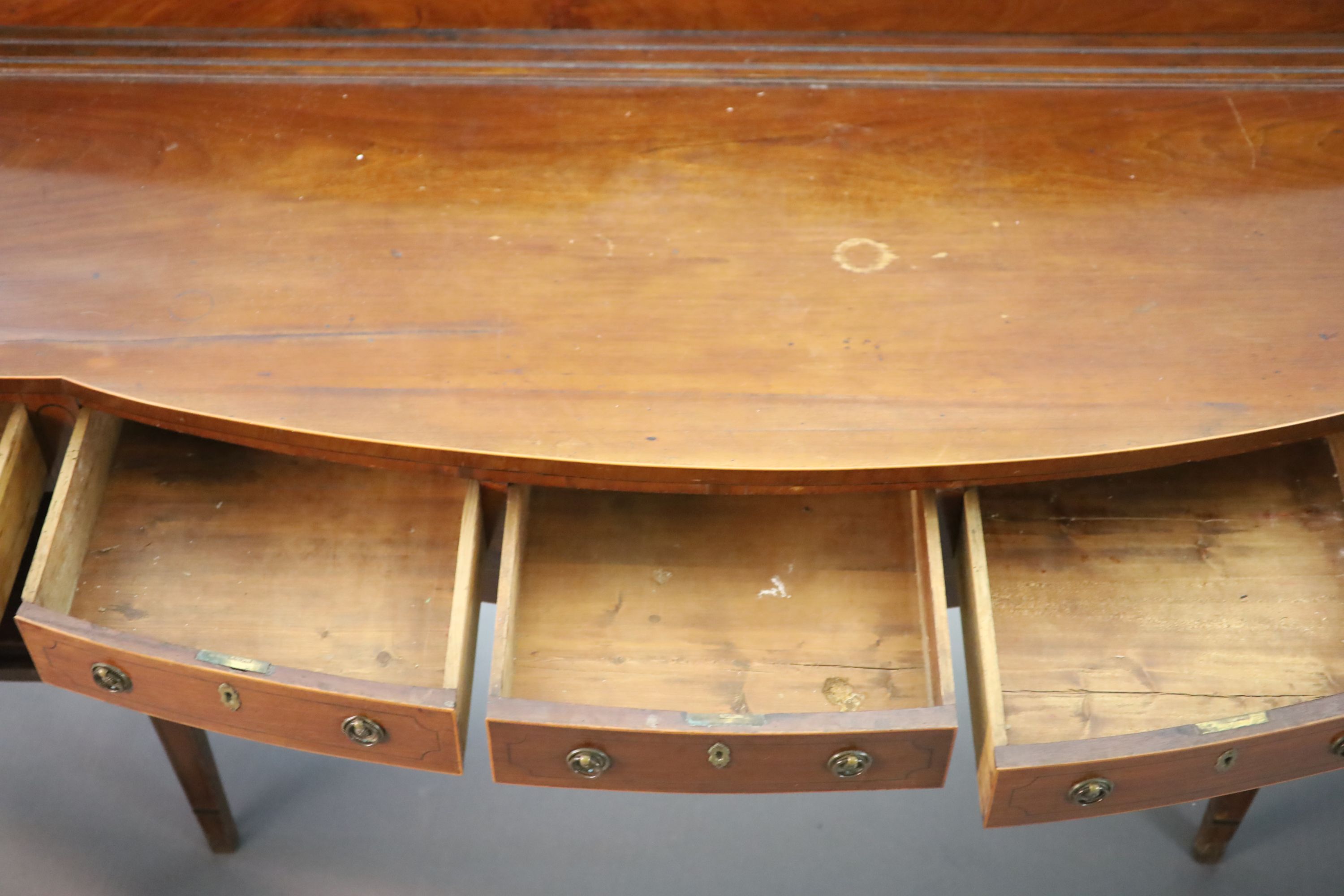 A Regency boxwood strung mahogany bowfront sideboard, W.241cm D.63cm H.118cm